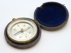 An antique brass cased compass with case, 56mm dia