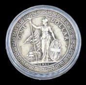 A 1911 British trade dollar with Chinese characters and Jawi script in ornamental flower to reverse,