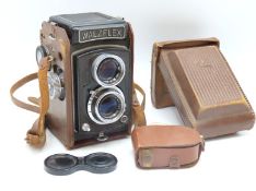 A Walzflex twin lens camera with case