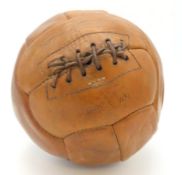 A 1950's hand sewn leather football, approx. 195mm