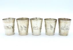 Five foreign silver shots, indistinct mark to insi