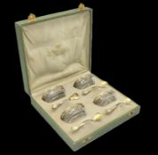 A c.1900 silk lined cased set of four 0.800 silver
