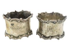 Two matched sterling silver napkin rings, one insc