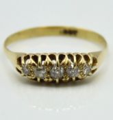 An antique 18ct gold ring set with five diamonds o
