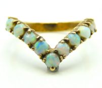 A 9ct gold opal wishbone ring, 2.8g, size O