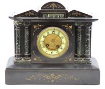 An antique architectural mantle clock with French