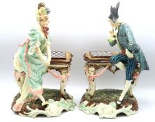 A pair of continental majolica figures depicting a