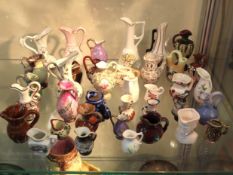A collection of miniature ceramic jugs