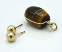 A pair of 9ct gold earrings, marks rubbed, twinned