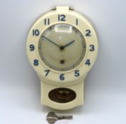 A Smiths 8 day cream bakelite wall clock, 255mm hi