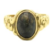 A 19thC. ring set with black agate type stone, cut