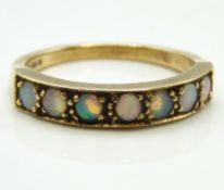 A 9ct gold half eternity opal ring, 2.5g, size O