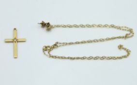 A 9ct gold chain with metal pendant lacking stone, 400mm long, twinned with a small 10ct gold cross