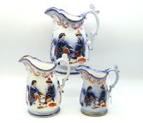 A Victorian set of three graduated jugs, repair to