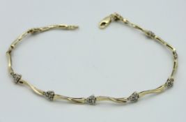 A 10ct gold bracelet set with 0.15ct of small diam
