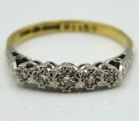 An antique 18ct gold ring with five platinum set d