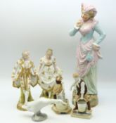 Two pairs of bisque porcelain figures, a larger bi