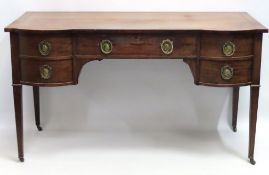 A mahogany George III desk with brass handles depi
