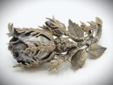 A two tone gilded white metal rose brooch, with de