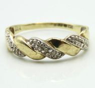 A 9ct gold ring of inter woven form set with three