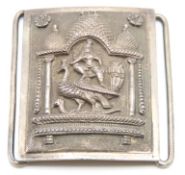 A two piece Tibetan white metal buckle depicting T