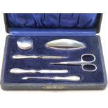 A cased 1923 Birmingham silver manicure set by R.