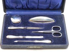 A cased 1923 Birmingham silver manicure set by R.