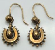 A pair of Victorian yellow metal earrings with luc