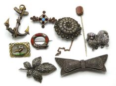A selection of silver & white metal brooches inclu