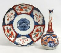 A 19thC. Japanese Imari vase twinned with Imari plate, both decorated with moths, two chips to plate