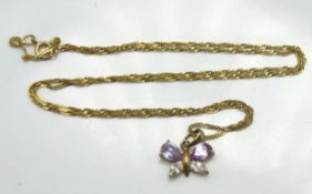 A 9ct gold chain set with yellow metal butterfly w