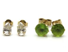 Two pairs of 9ct gold earrings, one set with perid