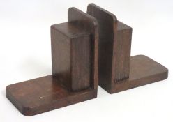 A pair of art deco style oak bookends, 150mm tall.