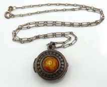 A silver chain with amber set locket, chain 460mm
