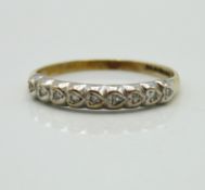 A 9ct gold half eternity ring set with nine small