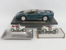 A Maisto diecast mounted model of a Jaguar XJ220 1