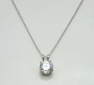 A 14ct white gold CZ necklace & pendant set, chain