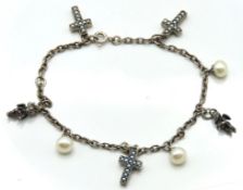 A silver charm bracelet set with cultured pearl, s