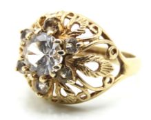 A 1960/70s retro pierced basket type ring set with white paste stones, 3.9g, size K/L