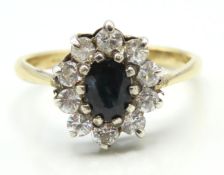 A gold on silver sapphire & white paste stone ring