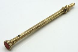An antique yellow metal self propelling pencil wit