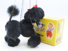 A vintage boxed Pelham Puppet of a poodle