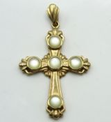A 9ct gold cross with mother of pearl decor, 38.5m