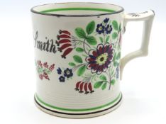 A 19thC. hand decorated pearlware mug with frog in