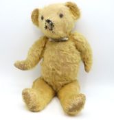 An antique Farnell style teddy bear, some wear & a