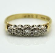 An antique 18ct gold five stone ring set with diam