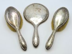 A three piece George VI Birmingham silver dressing table set by E. S. Barnsley & Co.