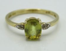 A 10ct gold ring set with white topaz & pale green