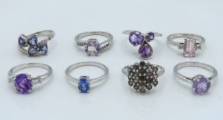 Eight sterling silver rings set with various stone
