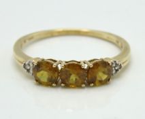 A 10ct gold ring set with diamond & citrine, 1.6g,